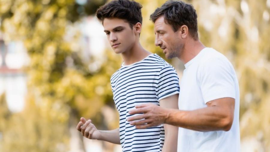 Dad walks and talks with his son