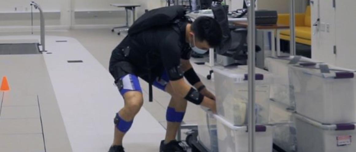 man wearing an exosuit to help with low back pain
