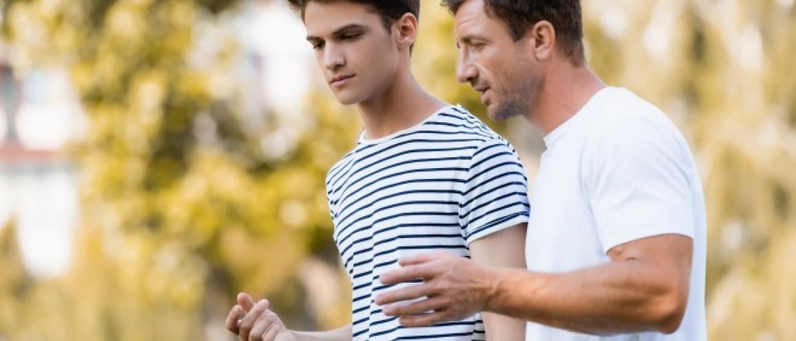 Dad walks and talks with his son